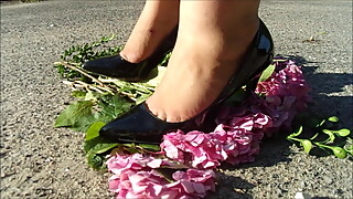 Wife crush flowers in black pointy heels