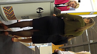 Candid expo girls in a office look black pantyhose and heels